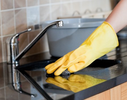 Professional Crooklog carpet cleaners refreshing a living room carpet