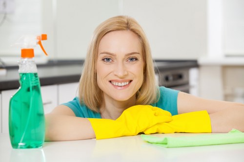 Carpet cleaning technician preparing equipment safely before starting work