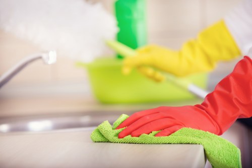Staff member using protective gear while handling carpet cleaning products